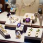 gold-jewelry-with-gems-showcase